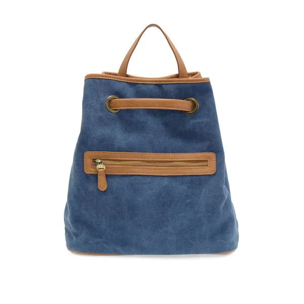 Memphis canvas backpack in blue suede with tan leather handles and zipper accents showcasing a stylish canvas backpack