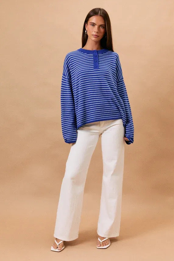 Blue and white striped long sleeve crew neck henley top with buttoned placket for casual wear