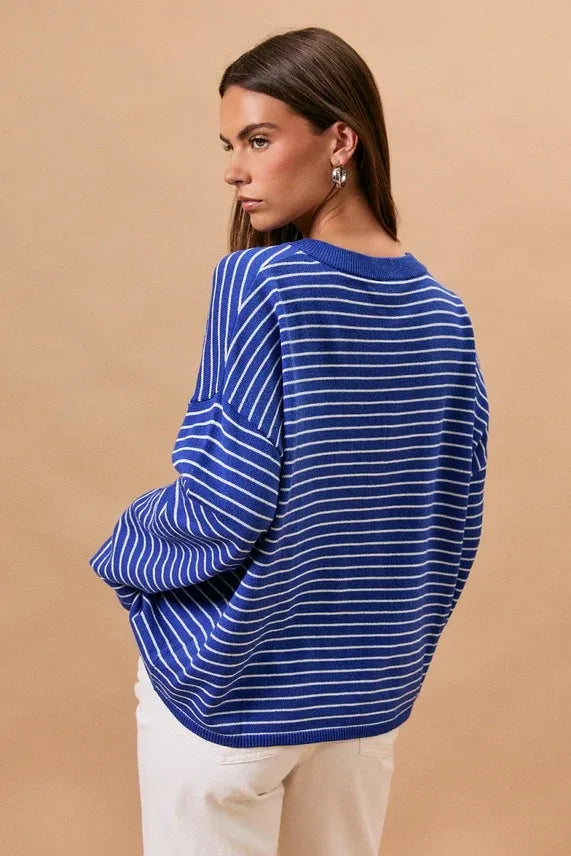 Blue and white horizontally striped knit long sleeve crew neck sweater with relaxed fit and comfortable material