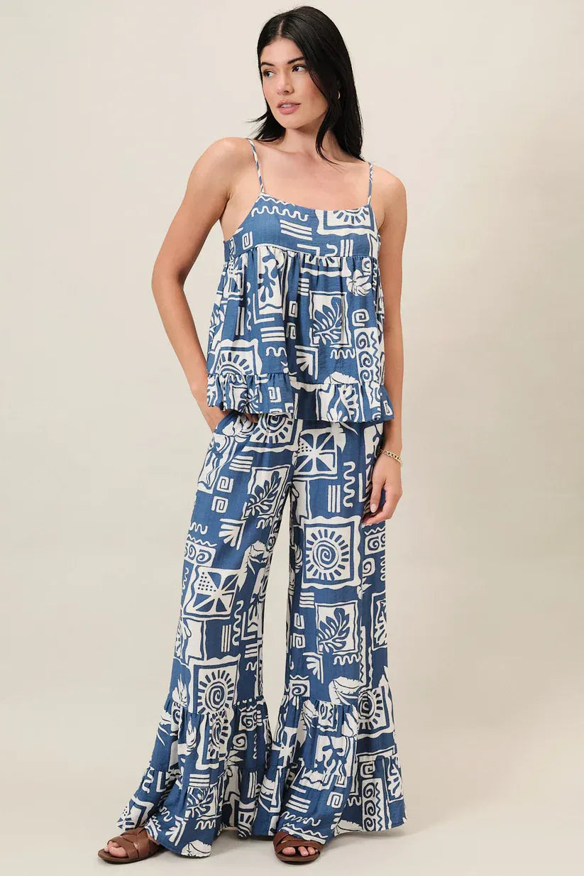 Blue and white abstract print spaghetti strap top with ruffled details in a matching two-piece outfit