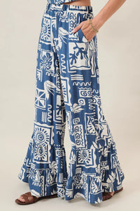 Blue and white abstract printed ruffle pants with wide-leg cut and ruffled hem for women’s boho chic clothing