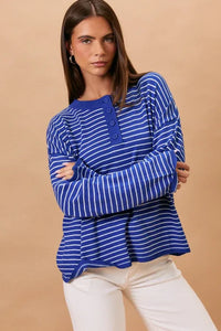 Blue and white striped knit long sleeve crew neck sweater with buttoned placket for casual wear