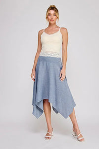 A blue and white vertically striped asymmetrical midi skirt paired with an adjustable strap floral lace bralette