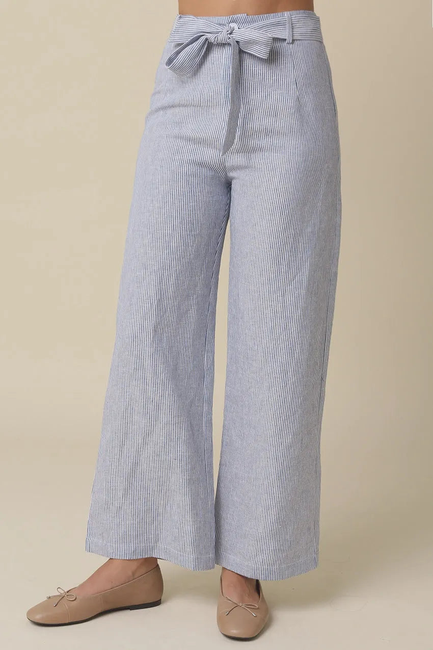 Malia striped tie waist pants featuring blue and white vertical stripes with a matching tie waist belt