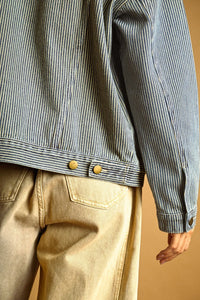 A blue and white striped pattern denim jacket with brass buttons showcasing a classic pattern denim jacket design