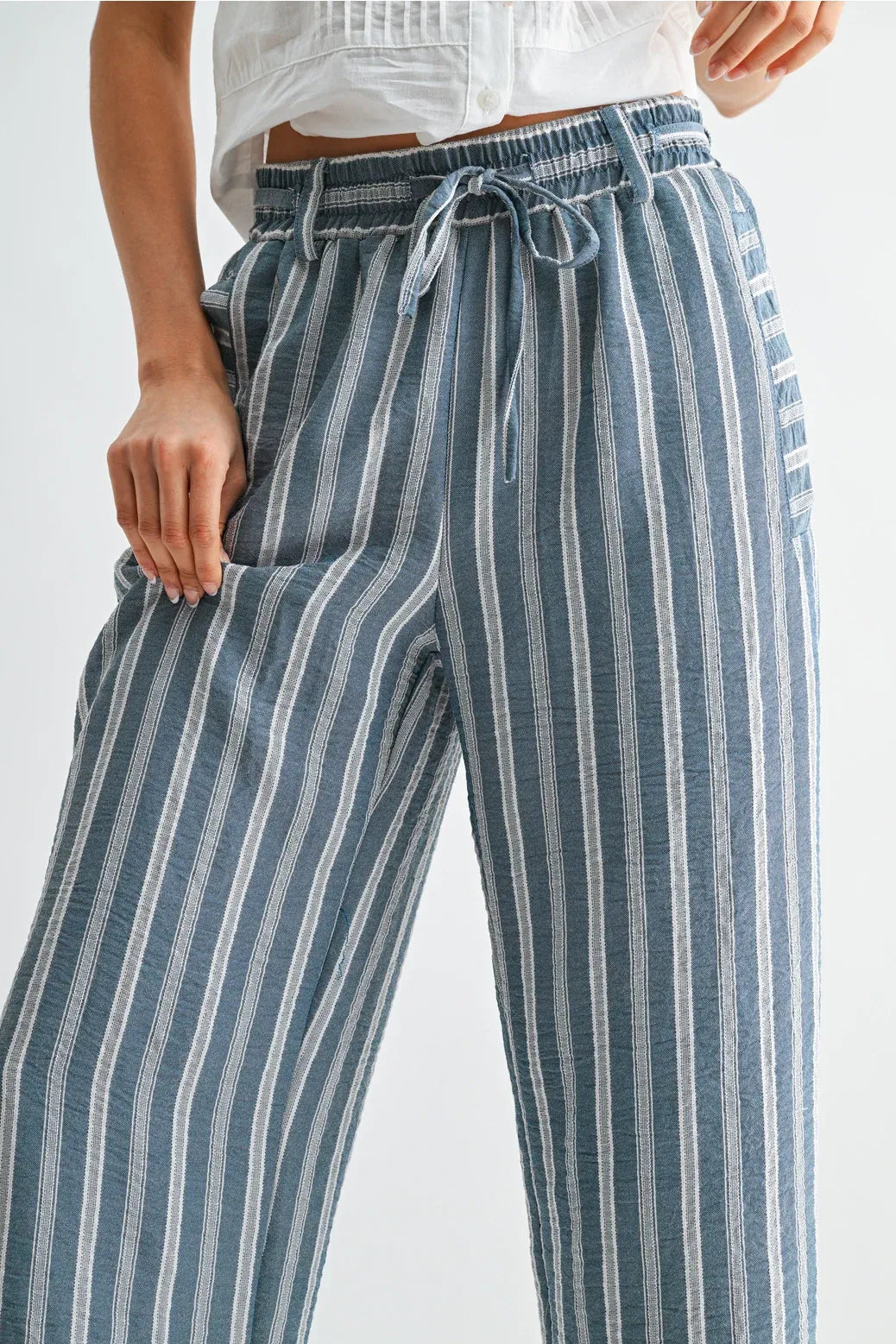 Blue and white striped wide leg drawstring pants with elastic waistband for comfortable casual wear