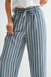 Blue and white striped wide leg drawstring pants with elastic waistband for comfortable casual wear