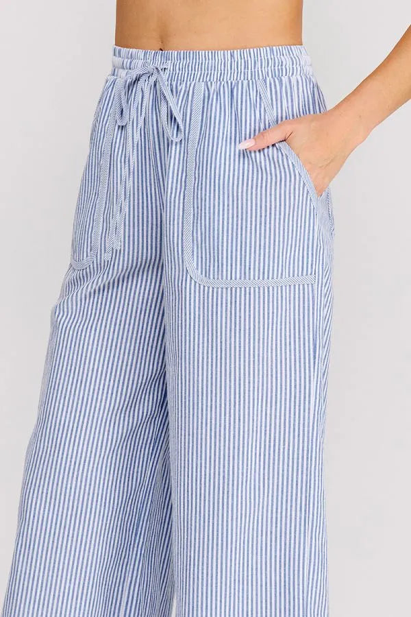 Blue and white vertically striped woven cotton blend pants with wide-leg fit elastic waistband and drawstring closure