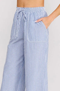 Blue and white vertically striped woven cotton blend pants with wide-leg fit elastic waistband and drawstring closure