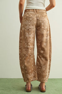 Brown paisley print washed wide-leg trousers with bandana pattern and soft faded denim texture