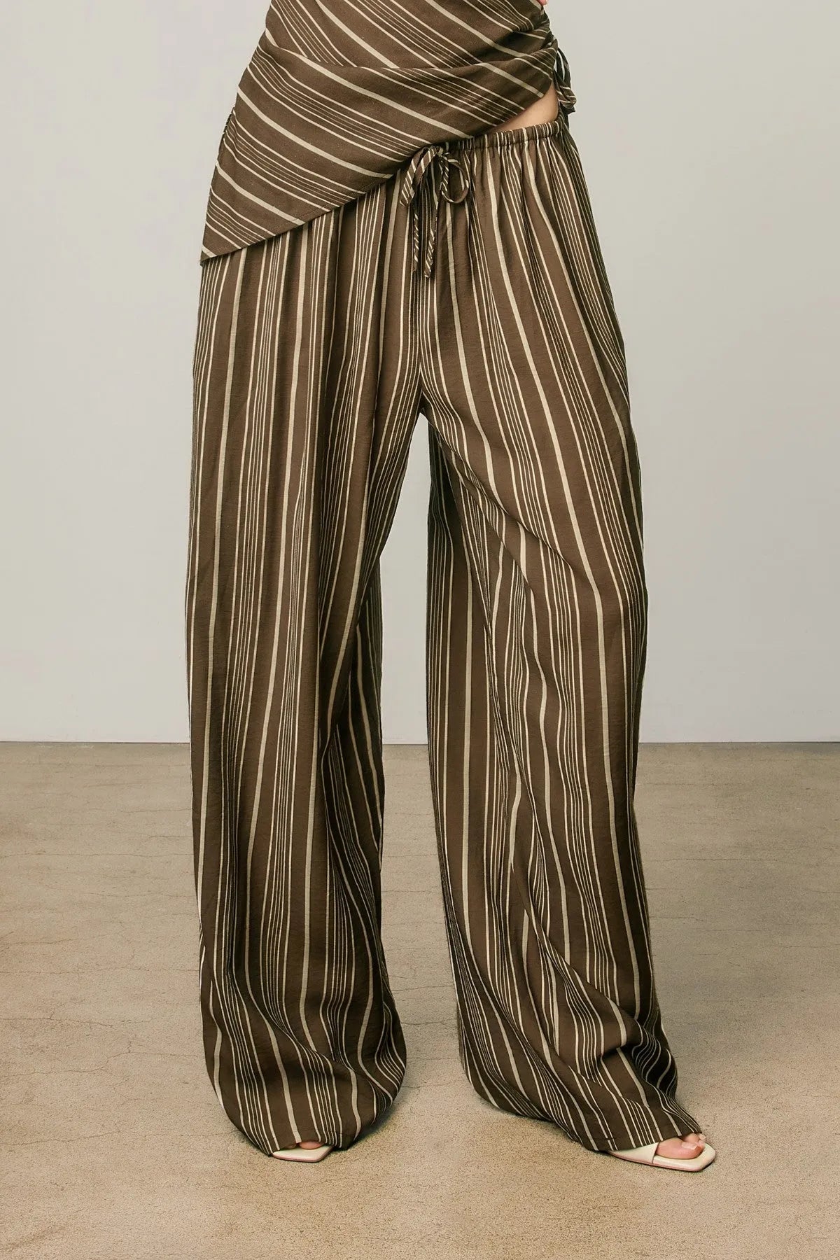 Brown and cream vertically striped stripe pull drawstring pants with wide-leg fit for women’s boho chic clothing