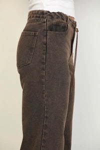 Brown overdyed straight leg denim jeans with drawstring waistband and classic front pockets in cotton material