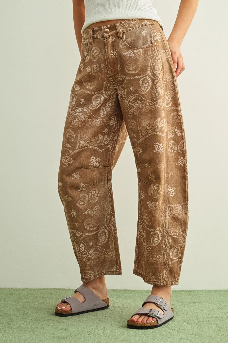 Brown denim paisley print washed pants featuring a subtle light-colored paisley pattern across the fabric