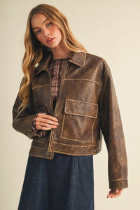 Brown faux leather coated knit boxy utility jacket with distressed texture and contrasting stitching