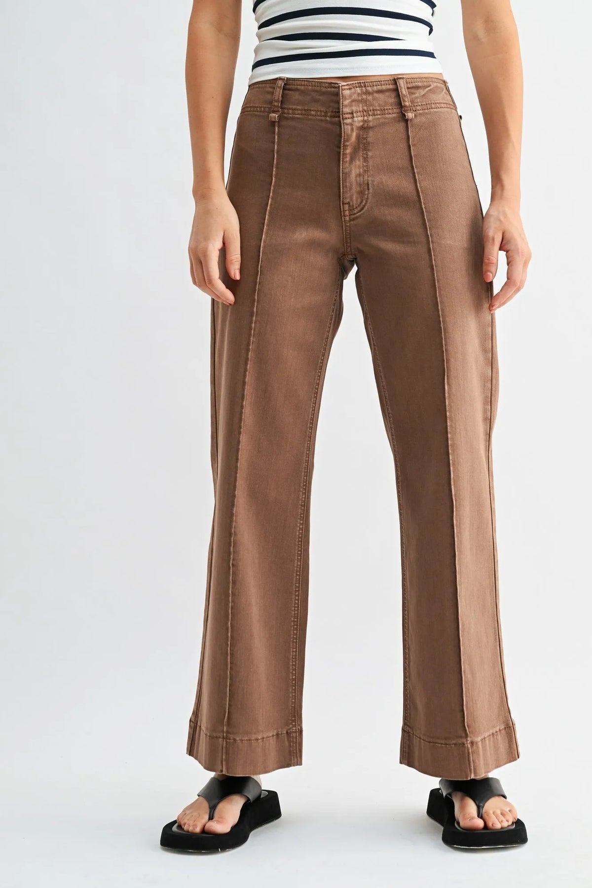 Brown mid rise twill wide leg denim pants with a straight cut silhouette and rolled cuffs