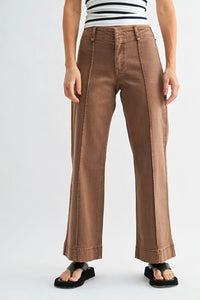 Brown mid rise twill wide leg denim pants with a straight cut silhouette and rolled cuffs