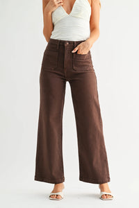 Brown high-waisted wide leg denim jeans with front patch pockets and button closure in sturdy denim material
