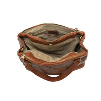 Brown leather janet puzzle convertible crossbody tote with gold-toned zippers and patterned interior lining