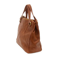 Brown leather janet puzzle convertible crossbody tote with gold-tone hardware and structured design