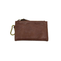 Brown leather bobbie bifold wallet with brass removable carabiner and zipper closure featuring joy susan logo