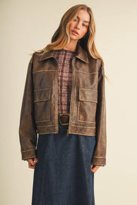 Brown leather moto jacket with distressed finish and contrasting stitching for coated knit boxy utility looks