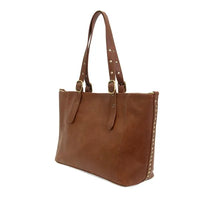 Brown leather shelby studded tote bag with studded handles and side trim for stylish everyday use