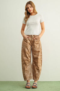 Brown paisley print washed wide-leg pants with a satin-like sheen in a paisley print washed fabric