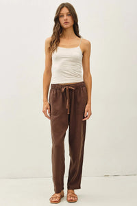 Brown tencel tapered pants with a relaxed fit drawstring waist and two side pockets for comfortable wear