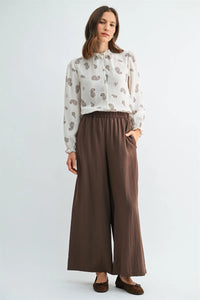 Brown satin wide leg pants with elastic waist and side pockets for comfortable stylish wear