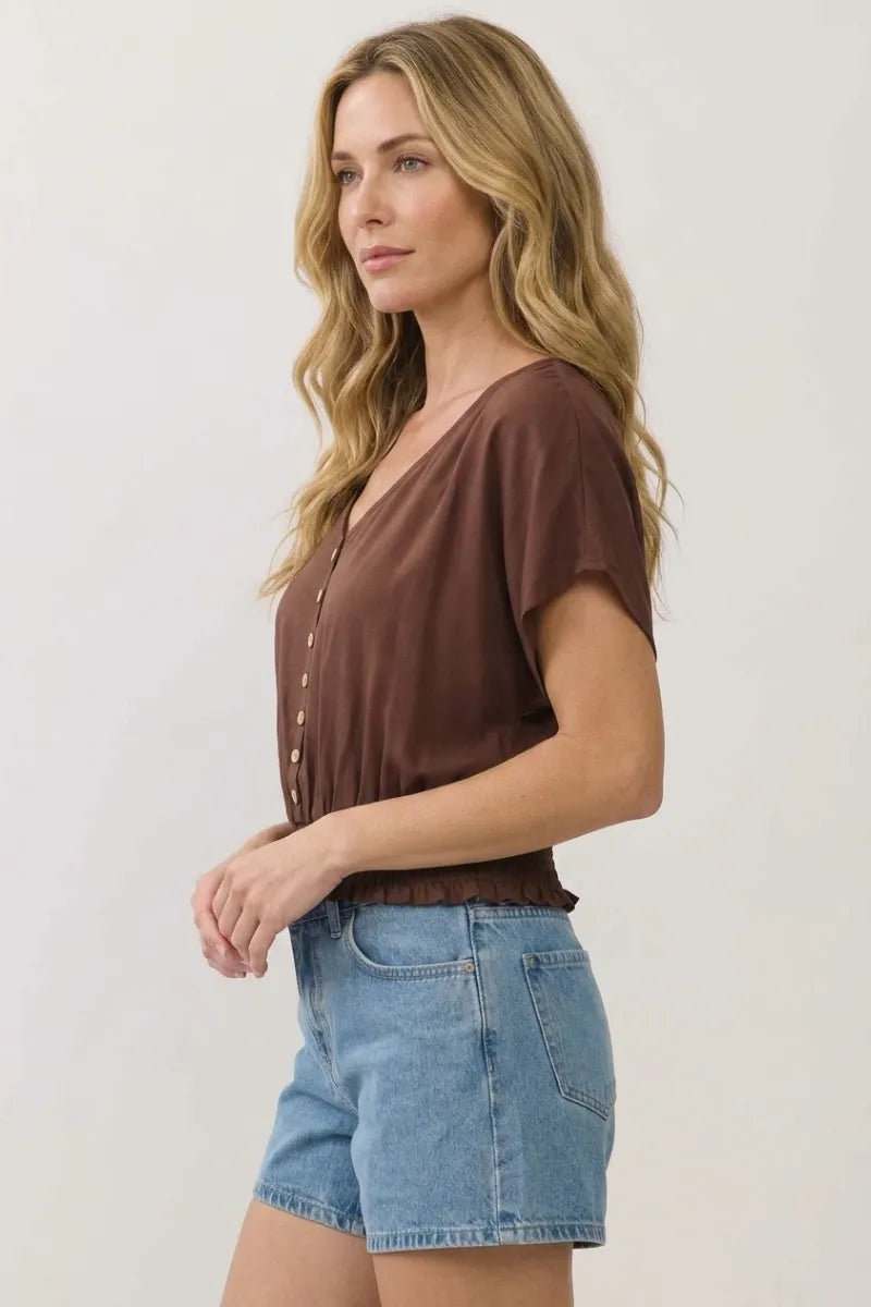 Brown short-sleeved v neck button detailed blouse with ruffled hem perfect for casual or office wear