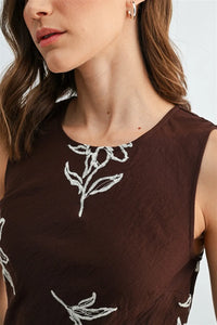 Brown embroidery sleeveless midi dress with white embroidered floral details on sleeveless midi dress fabric