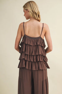 A brown cascading ruffle tiered v neck camisole top with thin straps paired with matching wide-leg pants set