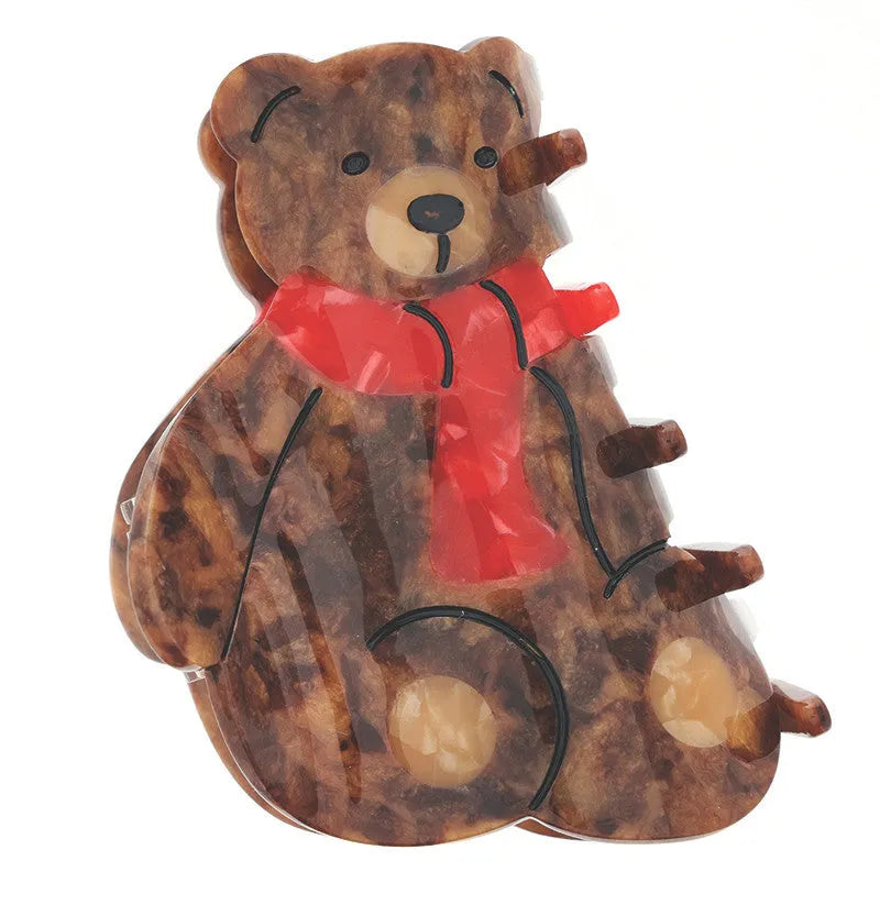 Brown bear claw clip hair accessory with tortoiseshell pattern and red scarf featuring black stitched details