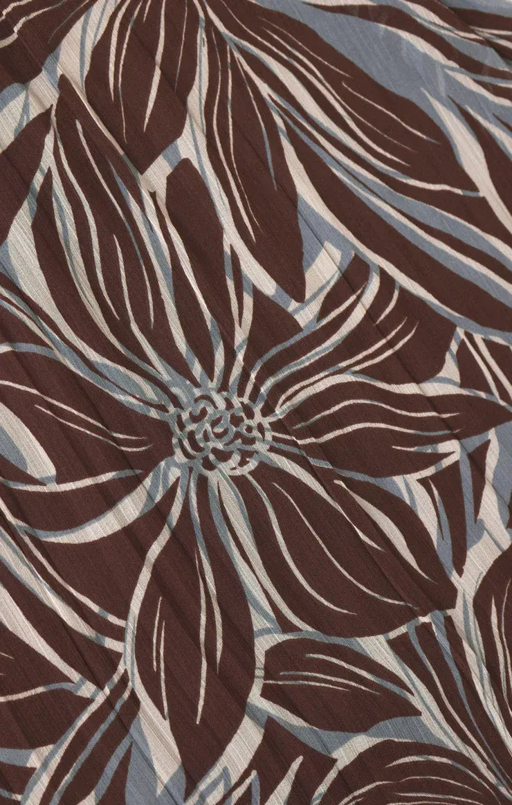 A lanie zinn floral maxi dress in brown and white floral patterned fabric with subtle texture
