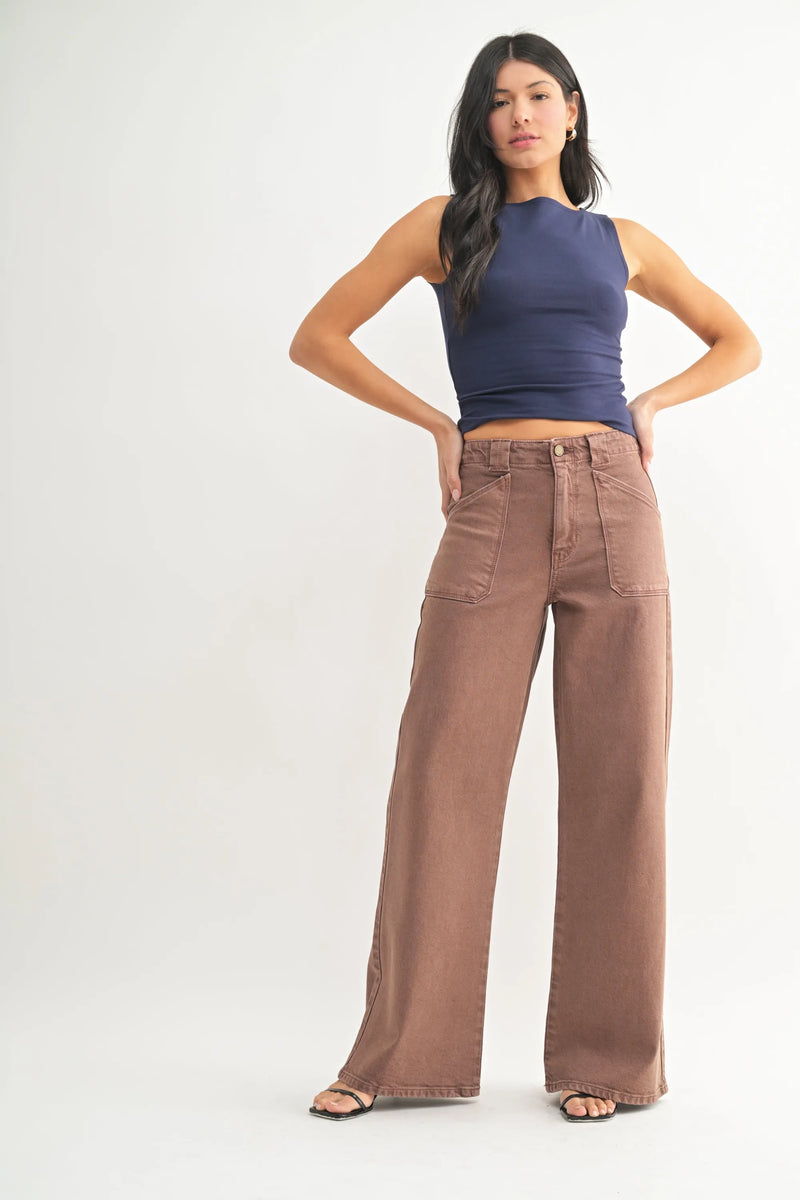 Brown high rise patch pocket wide leg flare denim jeans with front pockets and a relaxed fit silhouette
