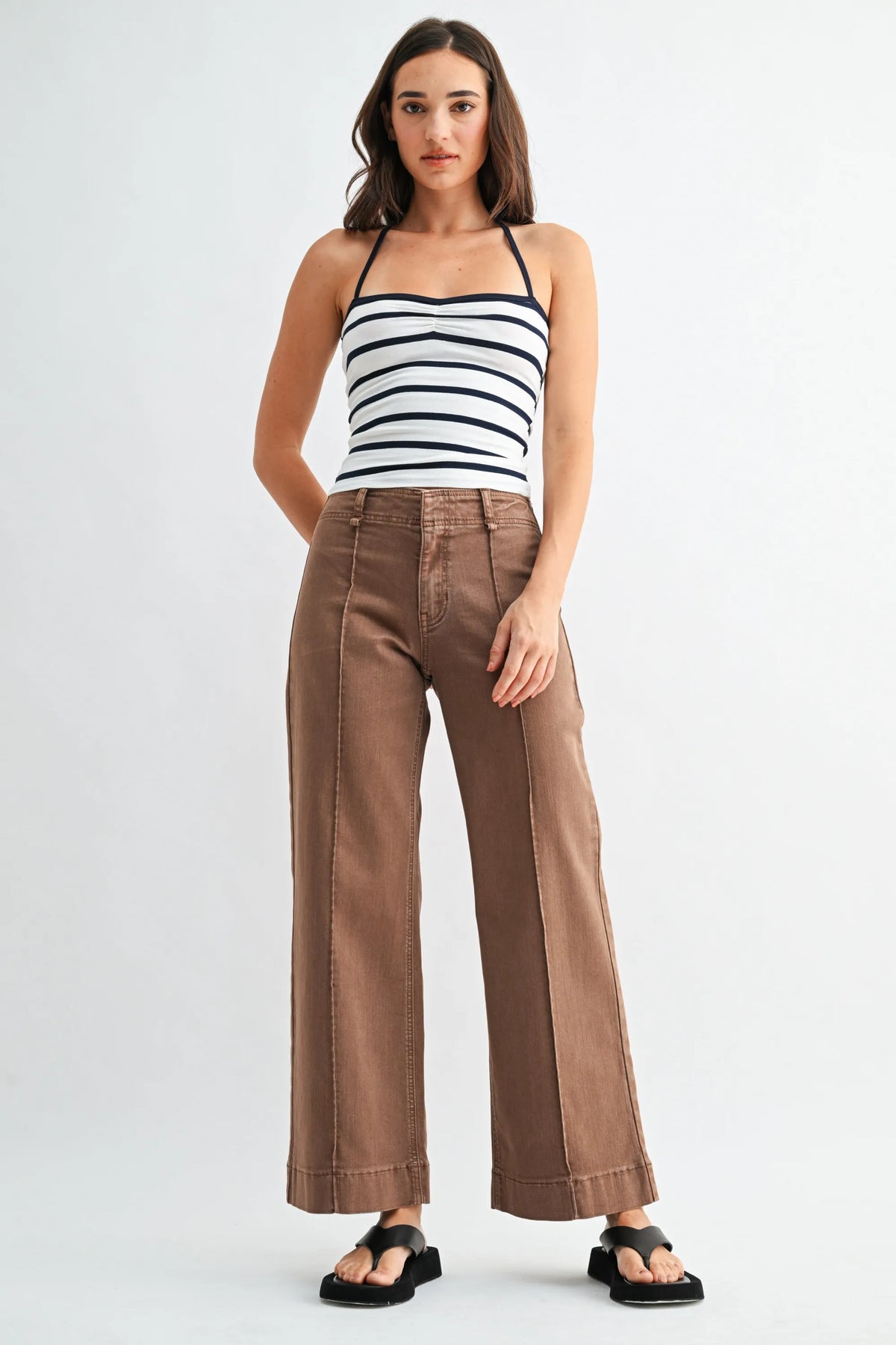 Brown mid rise twill wide leg trousers with high waist and visible stitching details in durable twill fabric