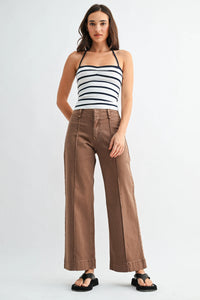 Brown mid rise twill wide leg trousers with high waist and visible stitching details in durable twill fabric