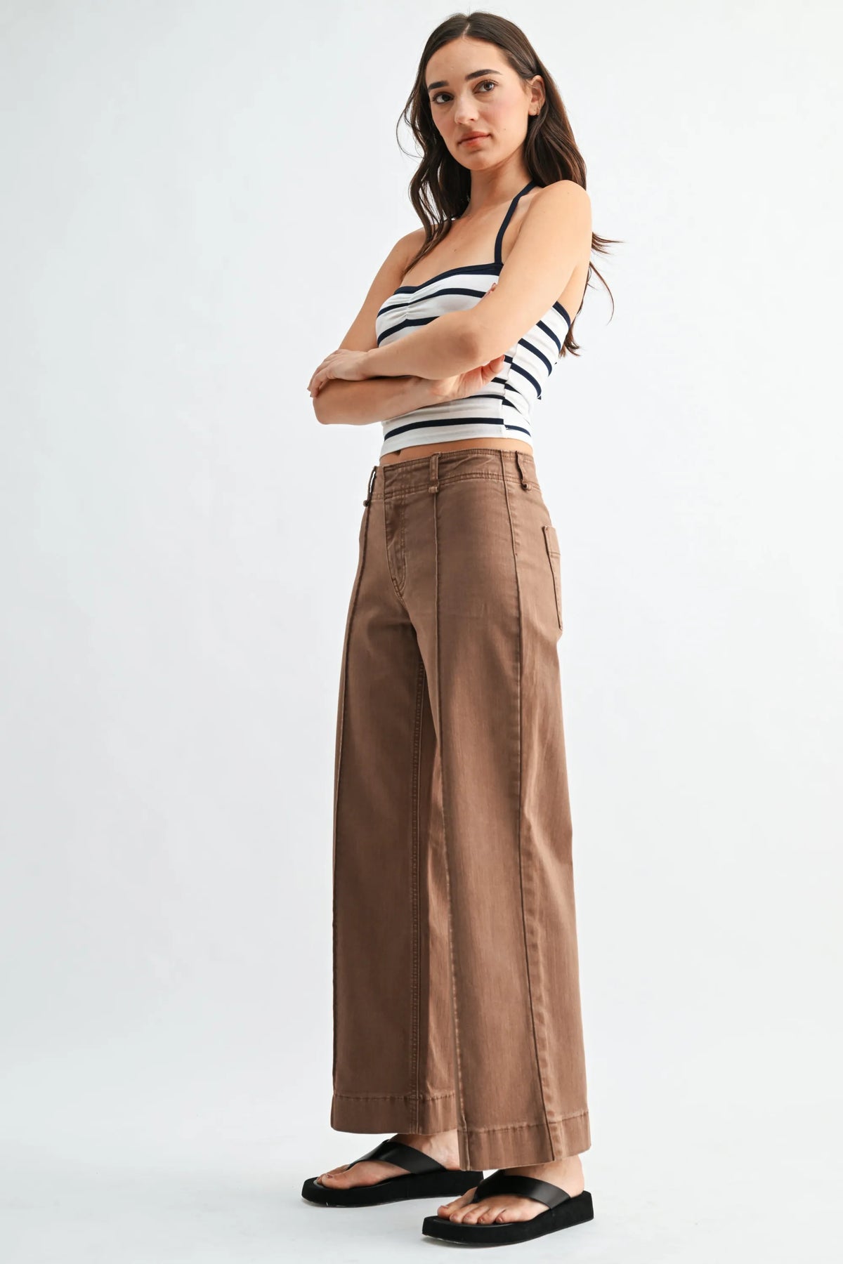 Brown mid rise twill wide leg trousers with a relaxed fit and subtle front pleats in a durable twill fabric