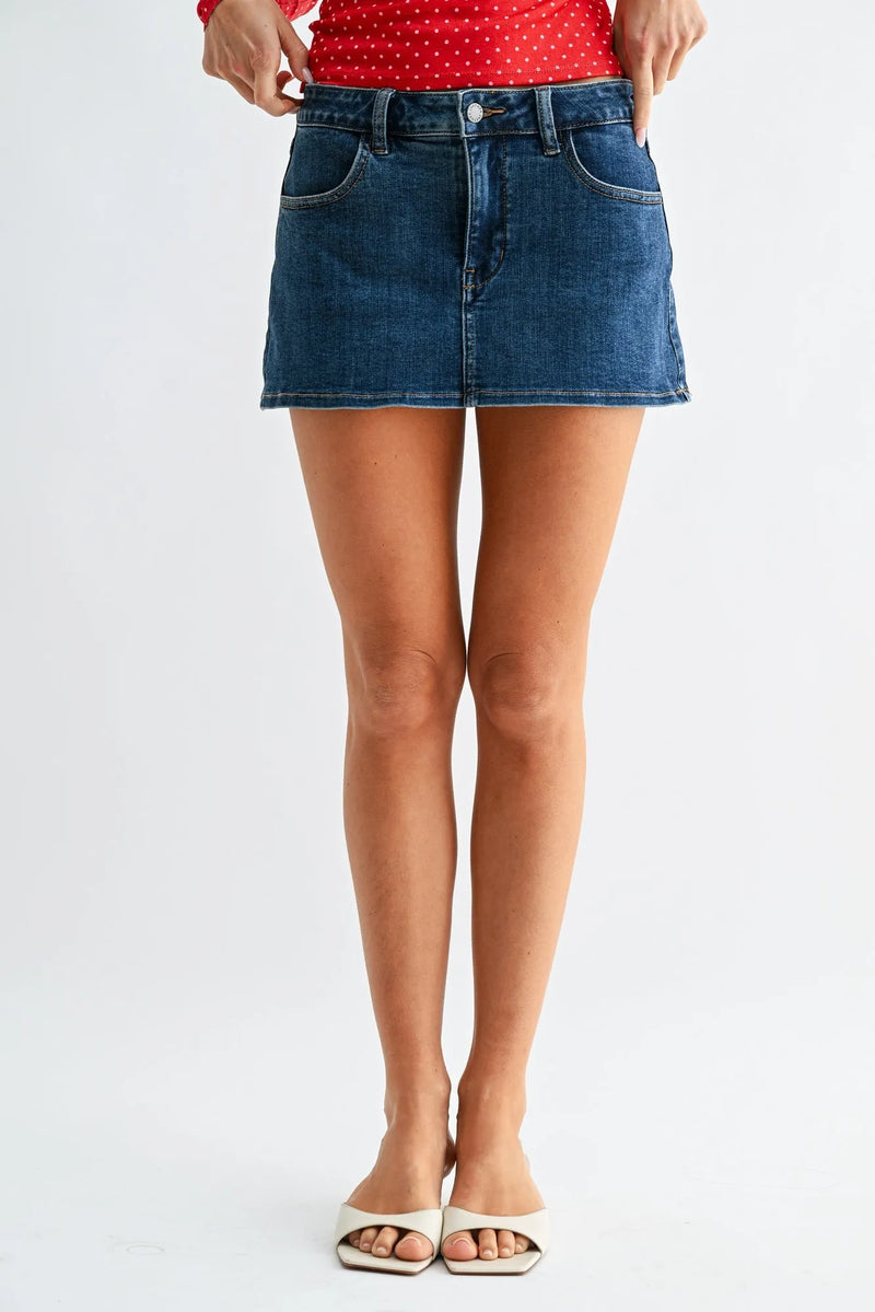 Classic mini denim high rise skort in blue with fitted waistband and two front pockets made from denim material