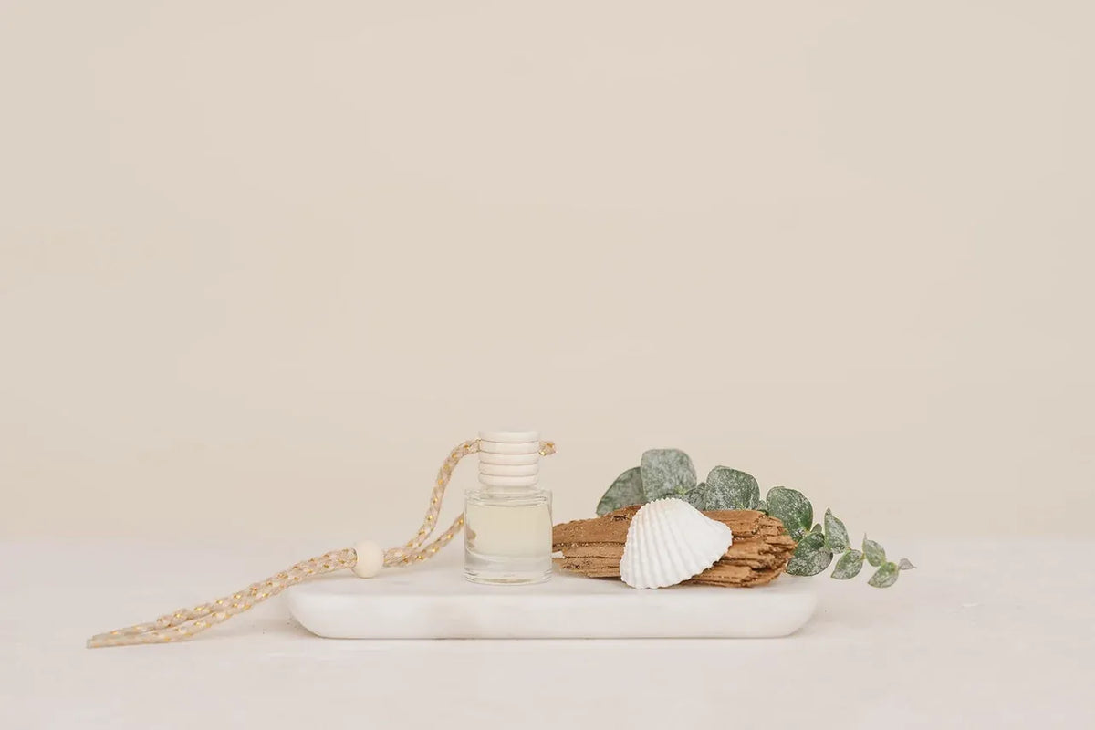 Clear glass bottle car diffuser with white beaded string and cap for hanging refillable luxury car air freshener