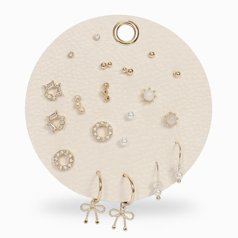 Ultimate curated earrings set with gold-toned and pearl studs on cream card
