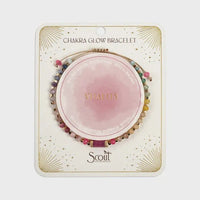 Chakra glow bracelet by scott featuring multicolored gemstone beads and a central pink vitality design in gold lettering