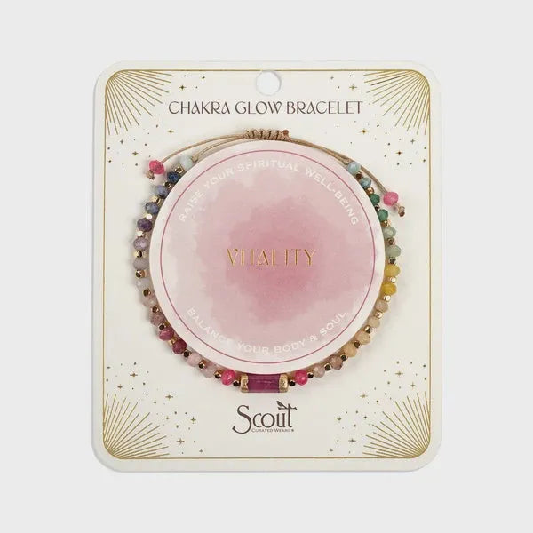 Chakra glow bracelet by scott featuring multicolored gemstone beads and a central pink vitality design in gold lettering
