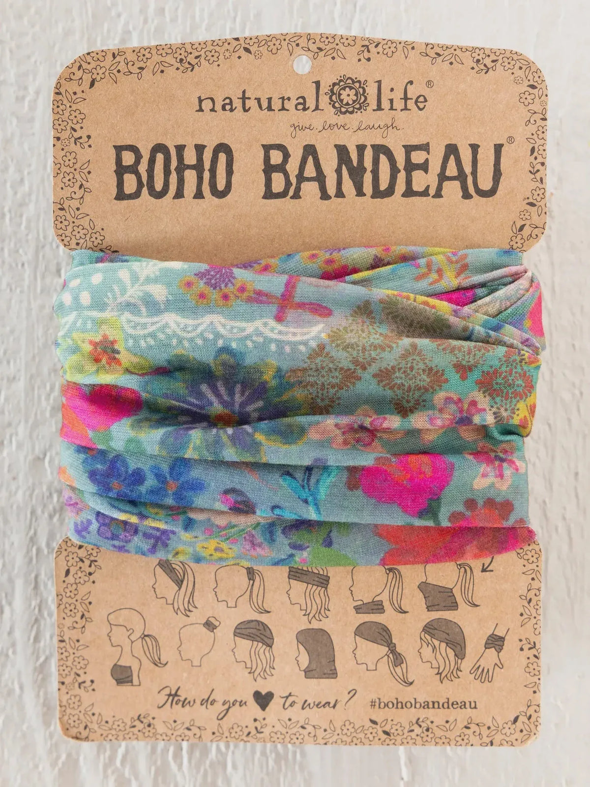 Colorful floral-patterned boho bandeau headband from natural life in blue garden patchwork with teal pink and purple hues