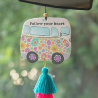 Car air freshener shaped like a colorful floral-patterned van with a turquoise tassel for car air use