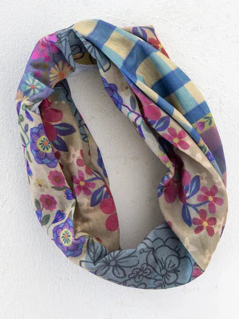 Full boho bandeau headband with floral patchwork in soft beige, blue, pink, and purple gingham floral patchwork pattern