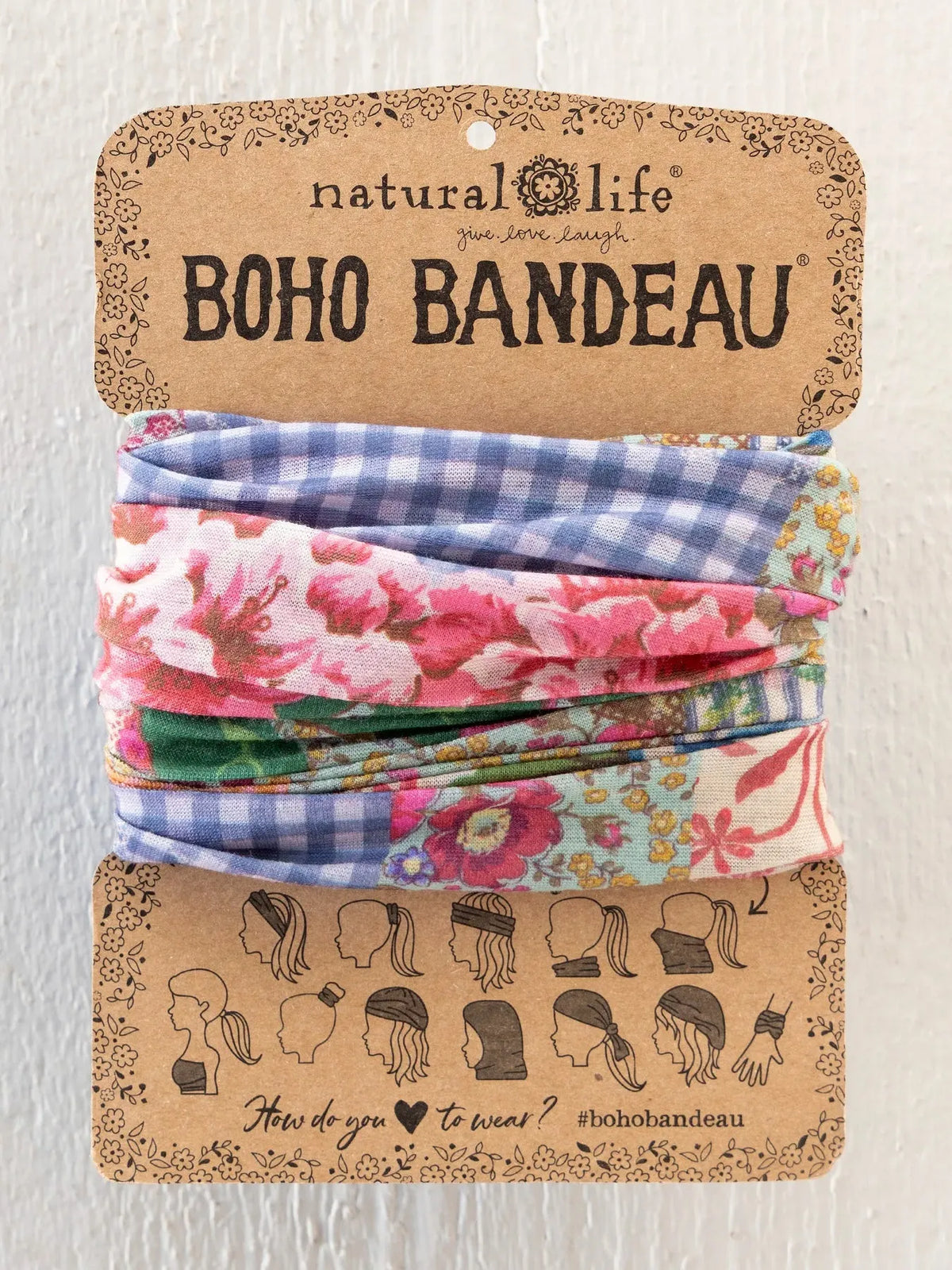 A colorful patterned boho bandeau headband set in vintage treasure pink by natural life for stylish wear