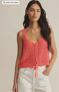 Coral-colored knitted tate laceup sweater tank with sleeveless design and front lace-up detail with matching drawstring