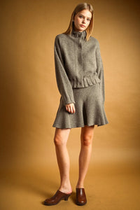 A cozy heather gray wool-blend cropped sweater with high neck button closure and flared sleeves