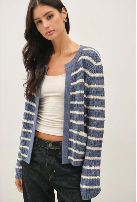 A cozy chunky knit striped open cardigan in soft blue and cream with long sleeves and an open front design